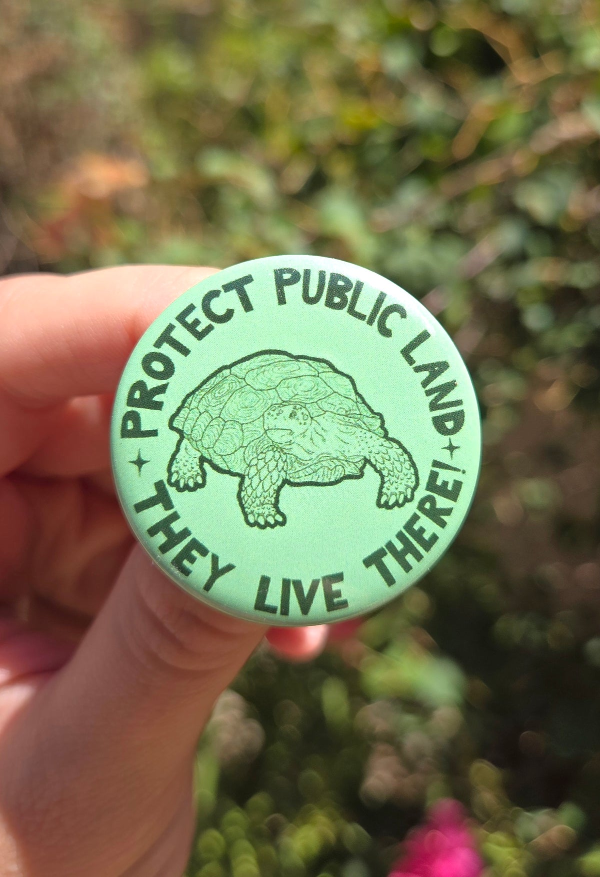 "Protect Public Land, They Live There!" 1.5 Inch Glossy Button Pin
